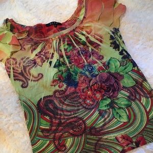 Embellished floral blouse.